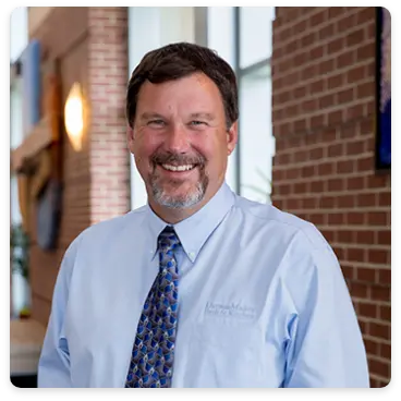 Michael Pinkerton, owner of DreamMaker Bath & Kitchen in Colorado Springs, smiles confidently