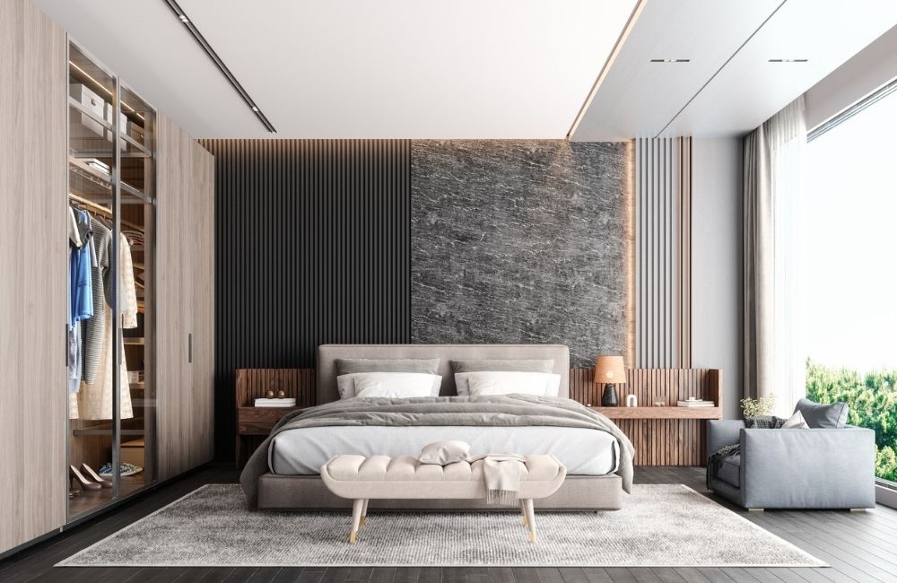 Luxurious primary suite in Schaumburg featuring a walk-in closet, modern bed, and large windows