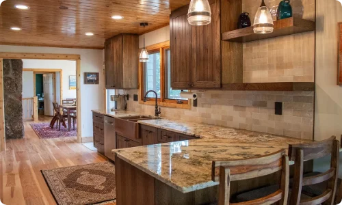 Stylish kitchen remodel featuring dark wood cabinetry, granite countertops, and modern fixtures in Schaumburg.