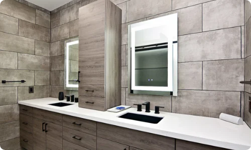 Modern bathroom remodeling featuring a double vanity with sleek fixtures and tiled walls, showcasing DreamMaker’s remodeling services in Schaumburg