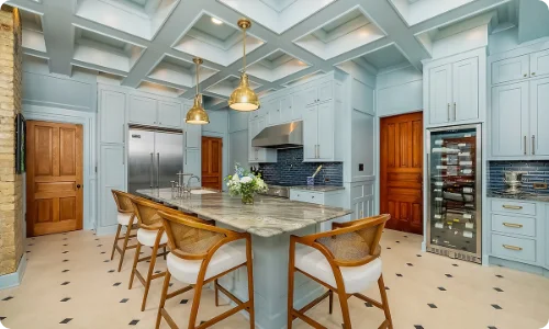Stylish kitchen remodel featuring light blue cabinetry, a large island, and modern appliances in Schaumburg.