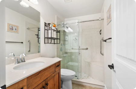 Stylish bathroom remodel featuring a glass walk-in shower and vanity in St. George, showcasing DreamMaker