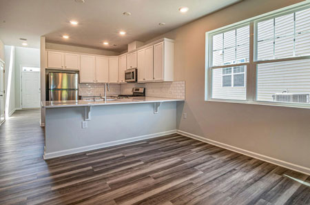 DreamMaker Bath & Kitchen showcases a remodeled kitchen with custom cabinetry and modern appliances in St. George