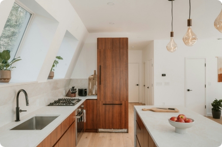Modern kitchen remodel featuring custom cabinetry and a skylight, showcasing DreamMaker’s quality work in St. George