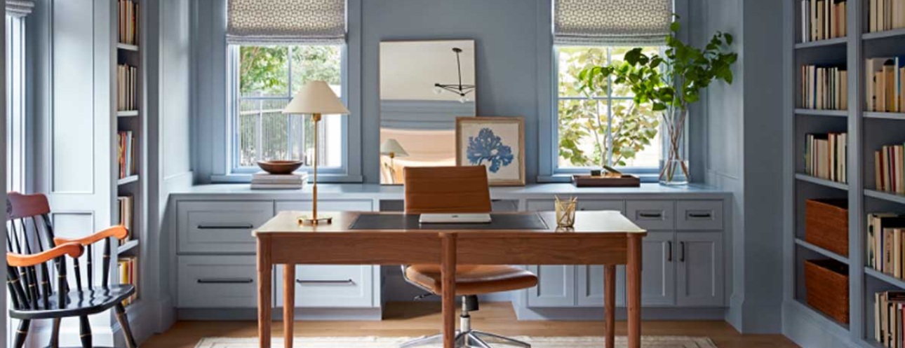 Stylish home office remodel in St. Louis Park, featuring built-in cabinetry, windows, and a wooden desk, showcasing DreamMaker’s remodeling