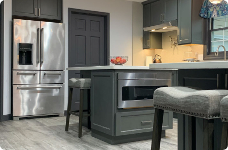 Accessible kitchen remodel in St. Louis Park, featuring gray cabinetry, stainless steel appliances, and a built-in oven