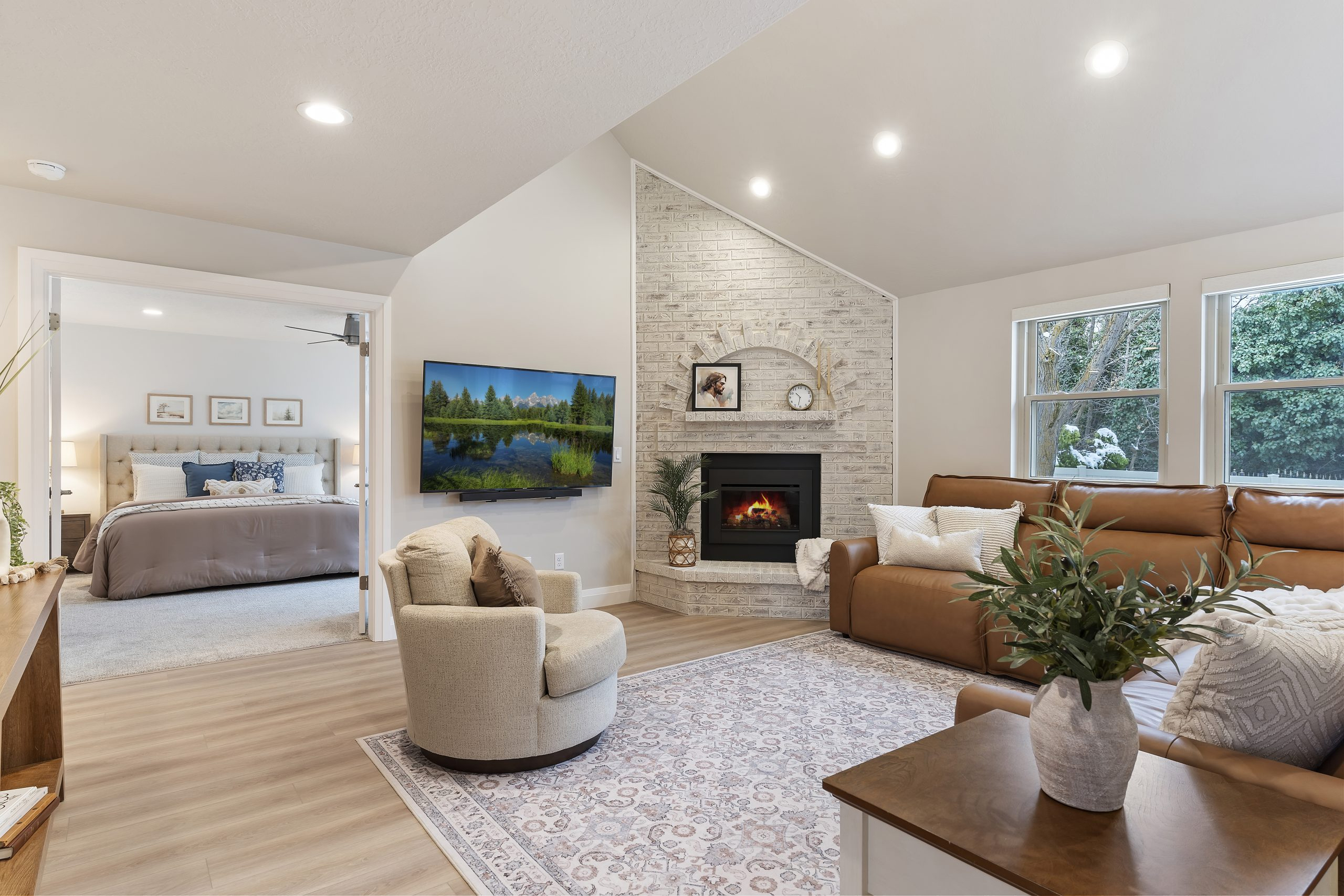 Stylish family room with a modern fireplace, comfortable seating, and an open view in Yavapai