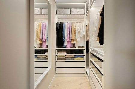 Custom cabinetry and storage solutions create an organized walk-in closet, showcasing DreamMaker's remodeling expertise in Yavapai