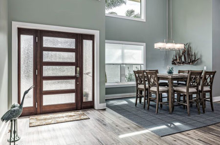 Modern dining area showcases custom cabinetry and flooring upgrades in a Yavapai, home remodel.